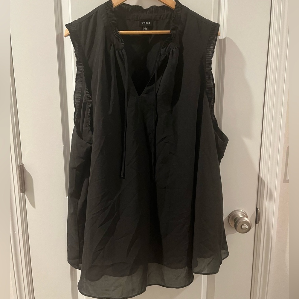 Torrid Black Sleeveless Blouse with ruffled embellishments.